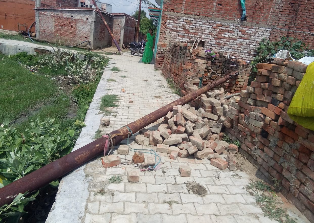 Two electric poles fell, wall and roof of two houses damaged