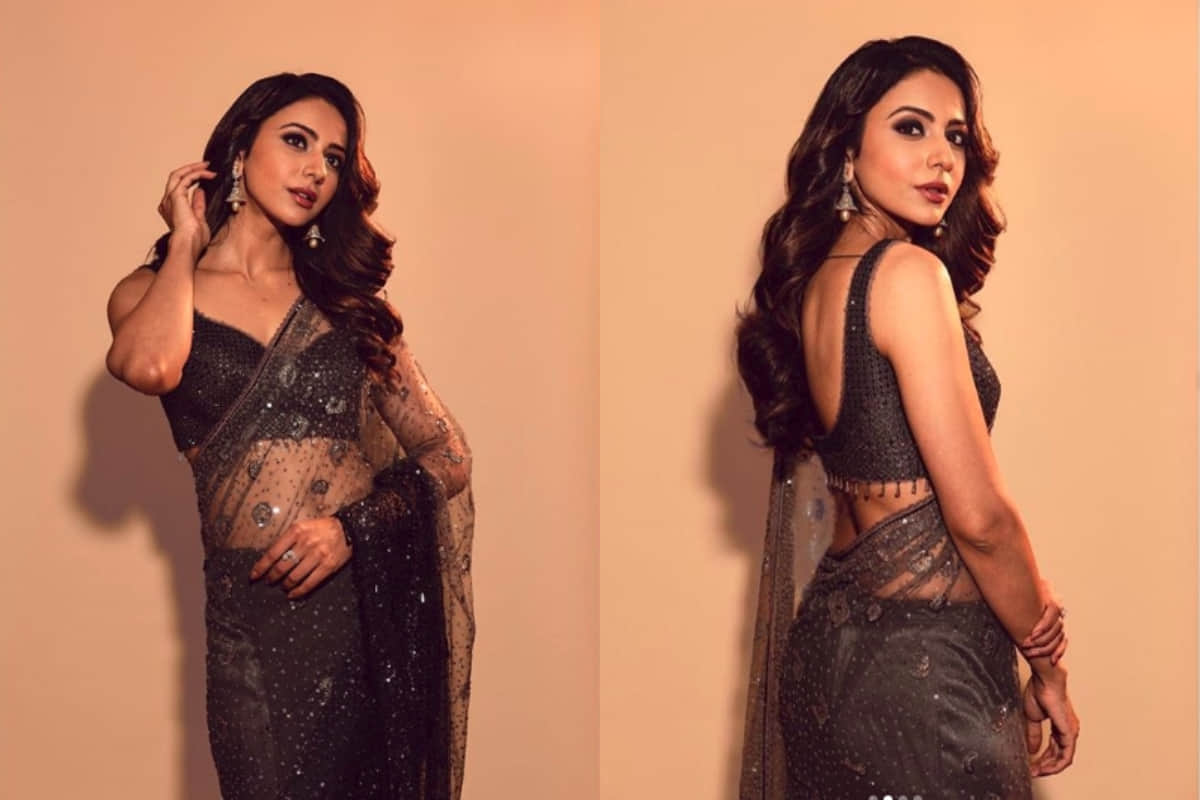 rakul preet looks stunning in traditional black net saree design by tarun tahiliani
