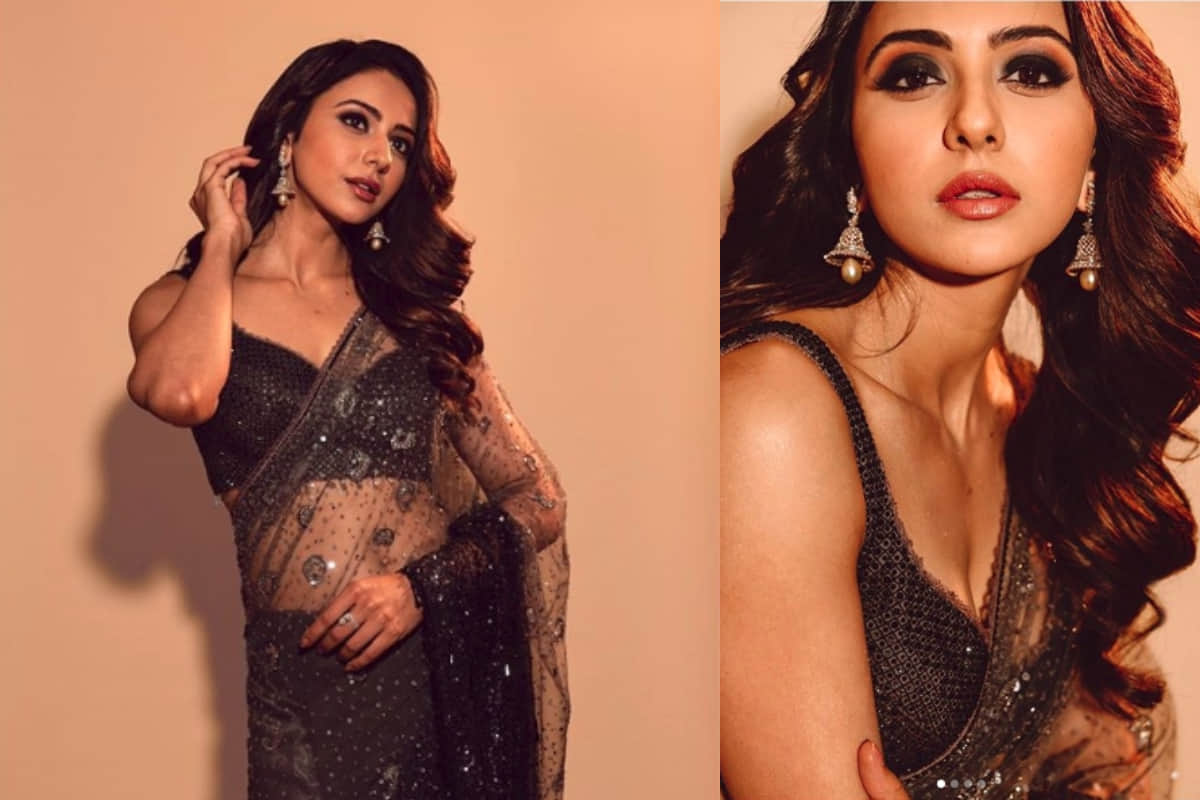 rakul preet looks stunning in traditional black net saree design by tarun tahiliani