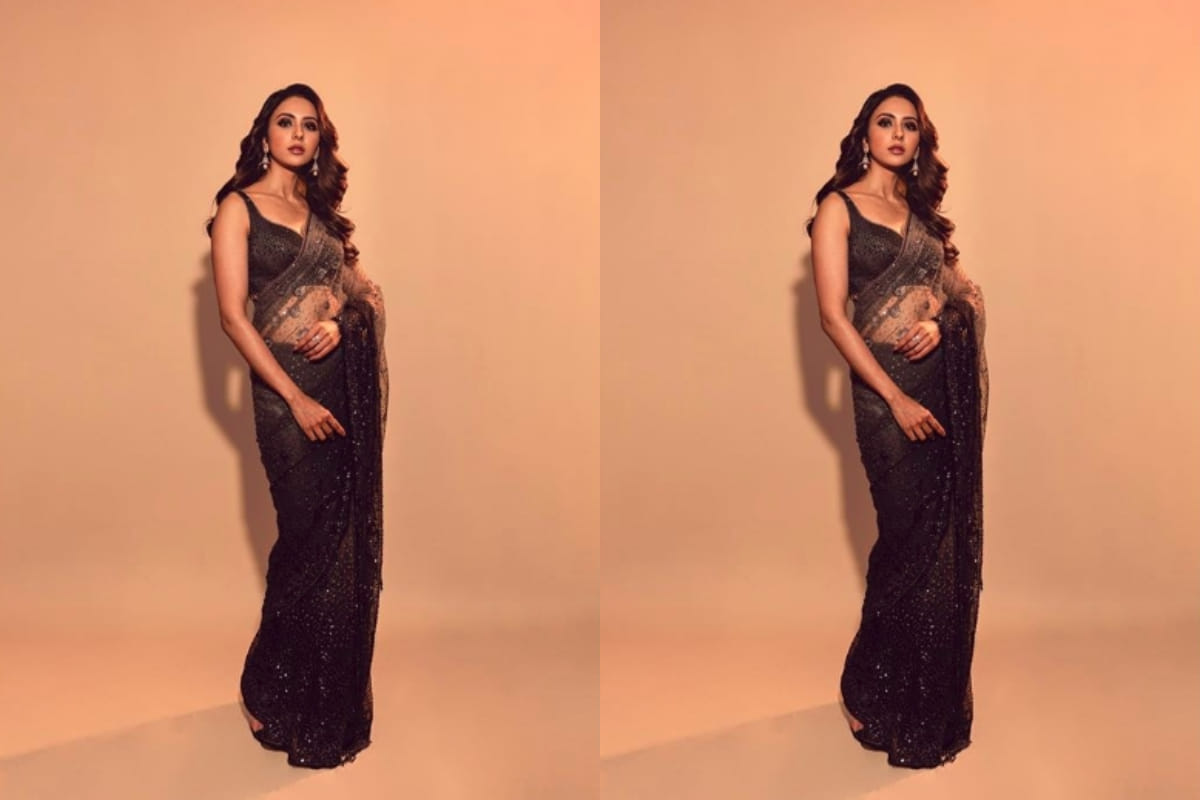 rakul preet looks stunning in traditional black net saree design by tarun tahiliani