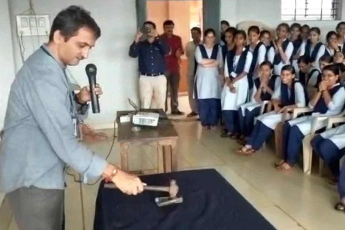 private college principal break mobile phones with hammer in front of hundreds of students