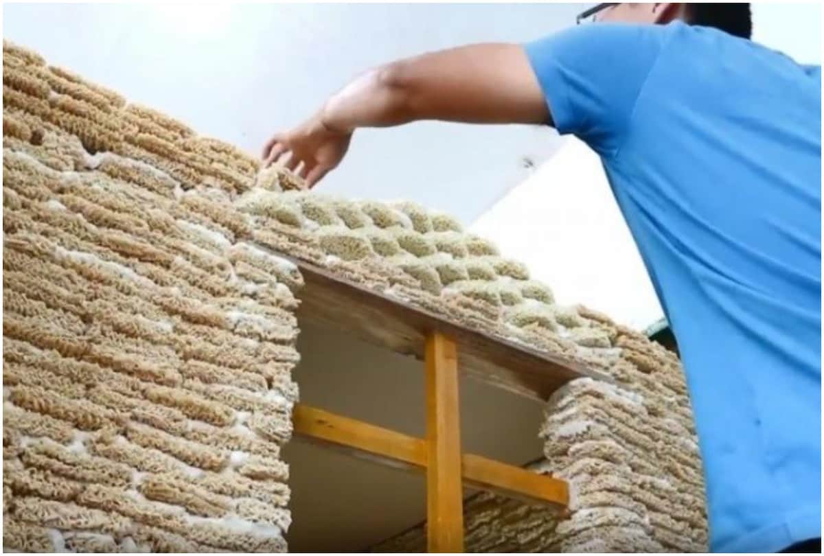 man builds childrens playhouse by instant noodle