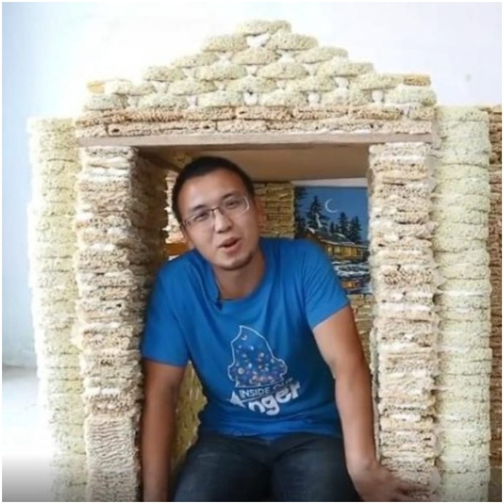 man builds childrens playhouse by instant noodle