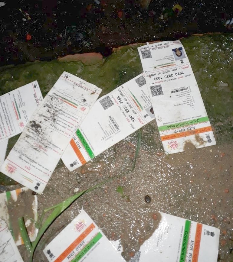 Aadhar card seen flowing in rain water