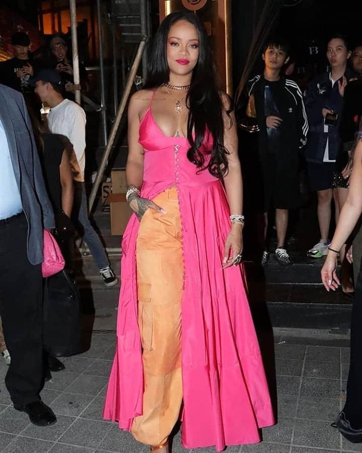 Rihanna spot in South Korea in pink maxi dress