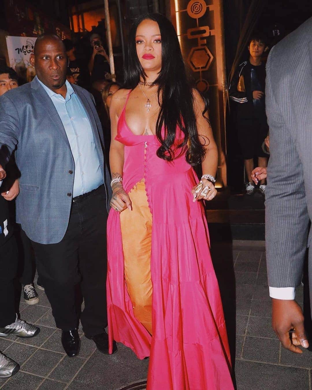 Rihanna spot in South Korea in pink maxi dress