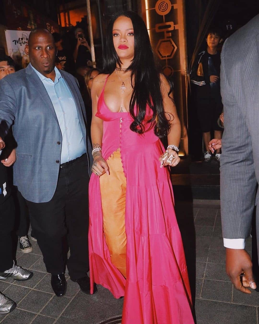 Rihanna spot in South Korea in pink maxi dress