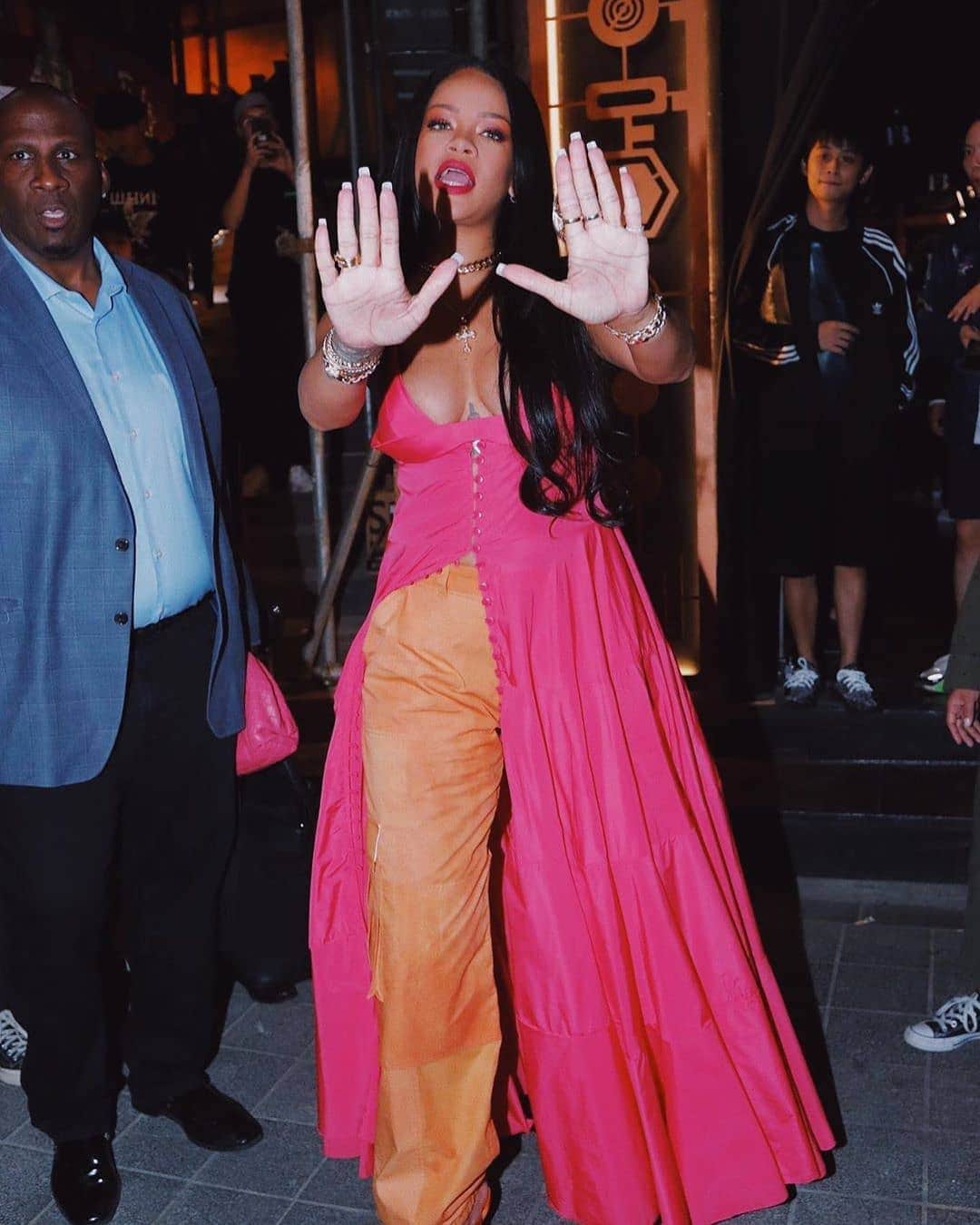 Rihanna spot in South Korea in pink maxi dress
