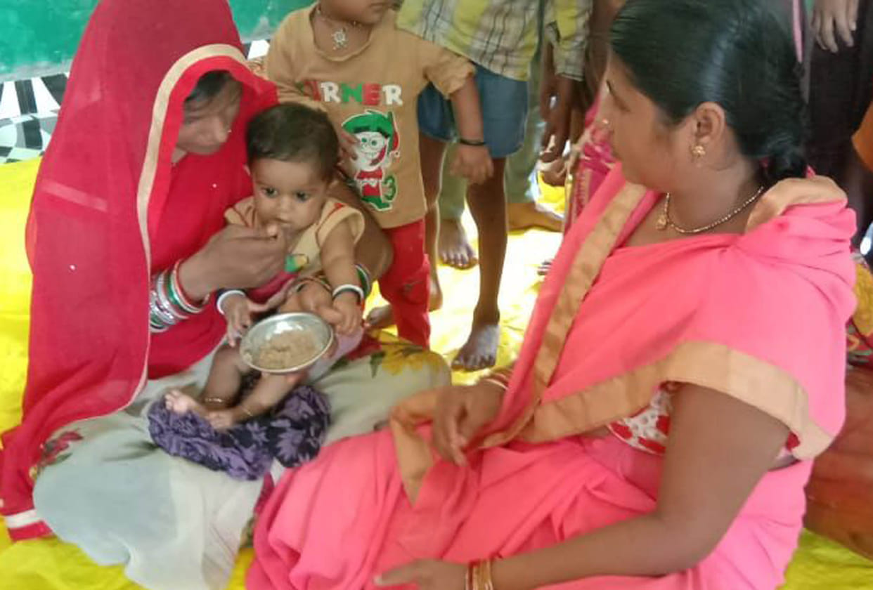 Children celebrated cereal feeding day with pudding