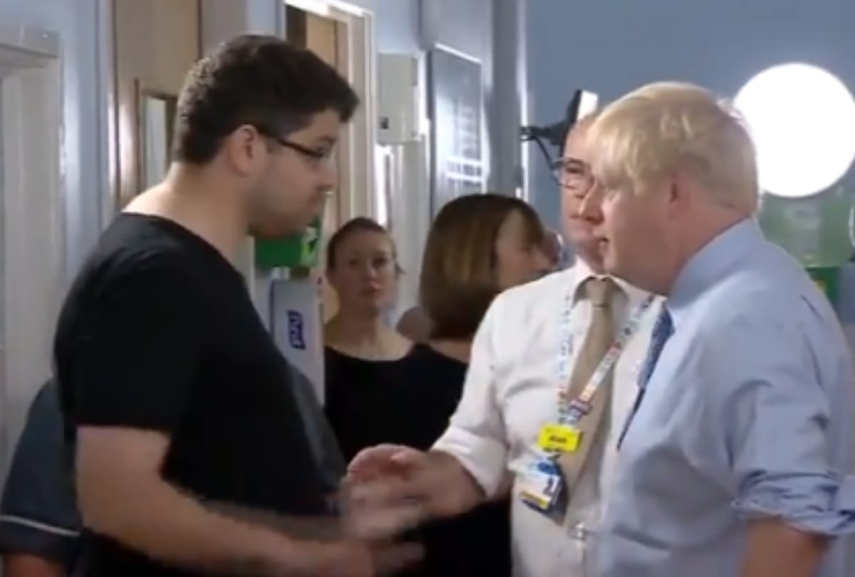 Father of a sick child confronts Boris Johnson during visit London hospital in front of camera