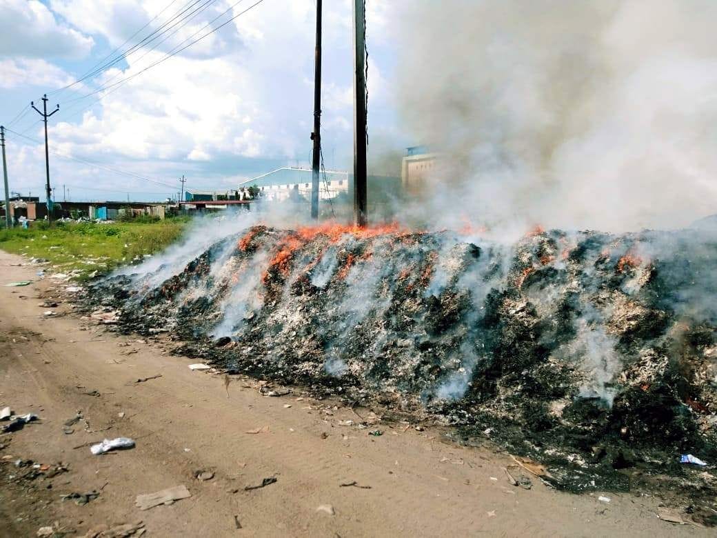 Fire in a pile of junk in Selakui