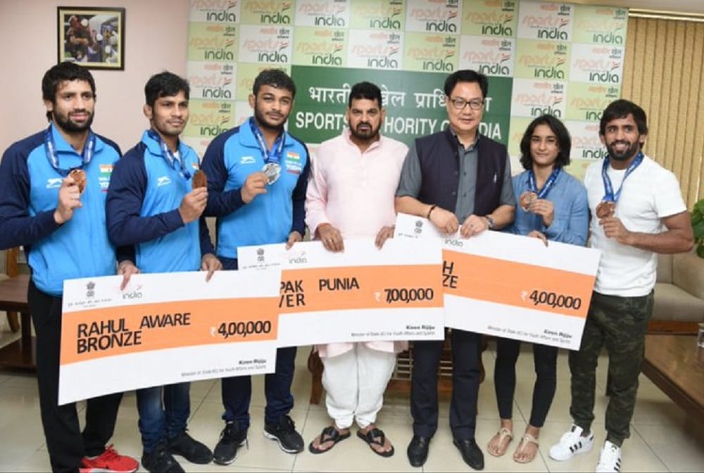 Sports Minister Honours Medal winning World Champianship Wrestlers With Cash