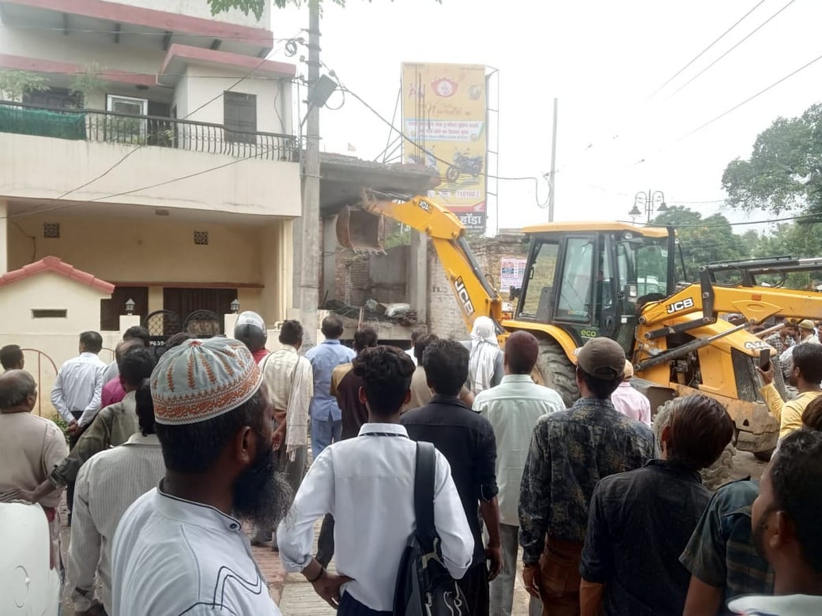 Fallen Shabby house four injured and bulldozer collapse illegal construction in varanasi