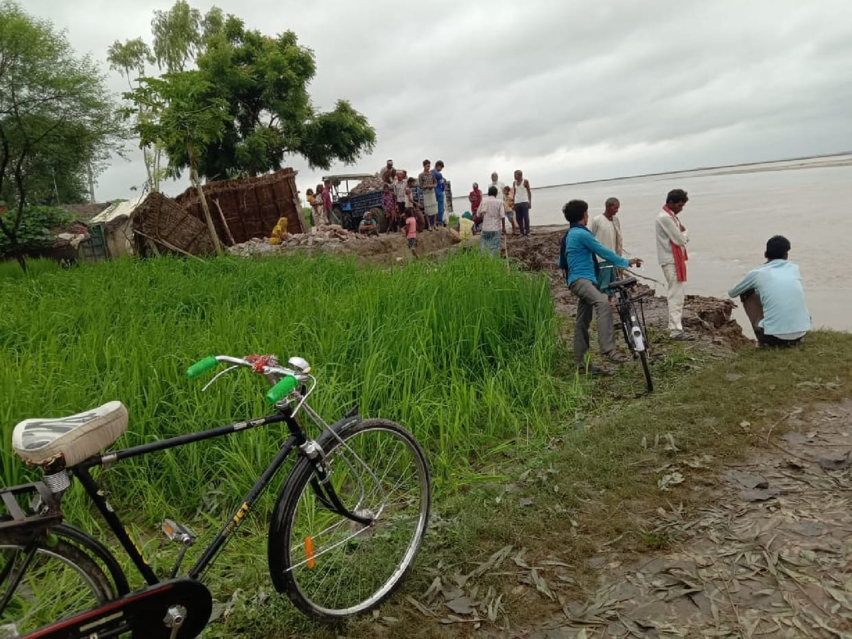 Two houses and 30 bigha fields in the river