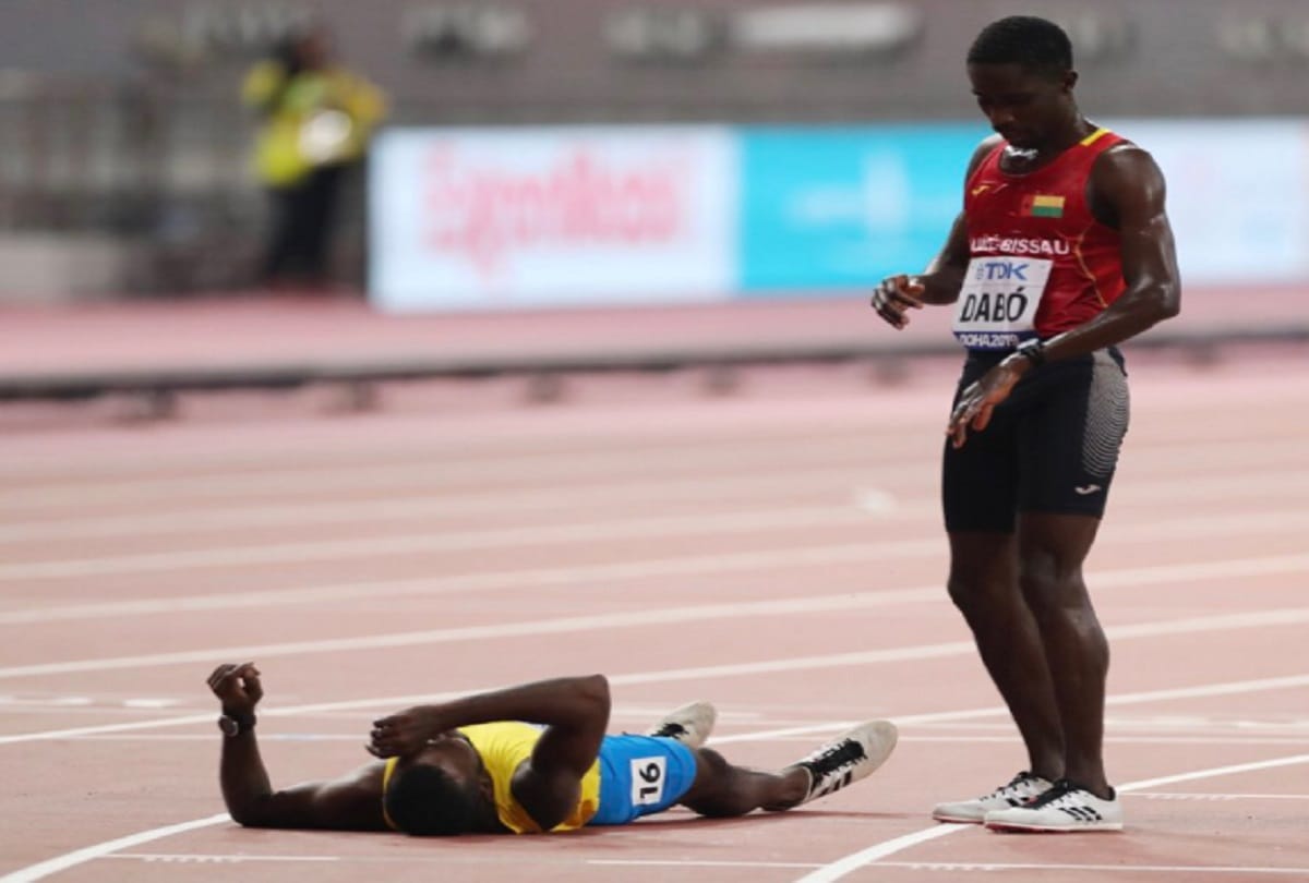 world championship Braima Dabo of Guinea Bissau wins heart helped injured Busby to complete race
