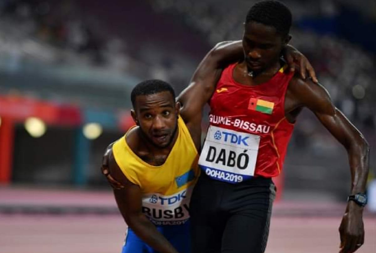 world championship Braima Dabo of Guinea Bissau wins heart helped injured Busby to complete race