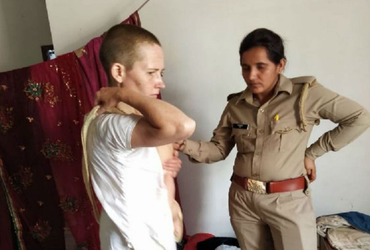 Russian woman attempts to jump off roof with her child in vrindavan