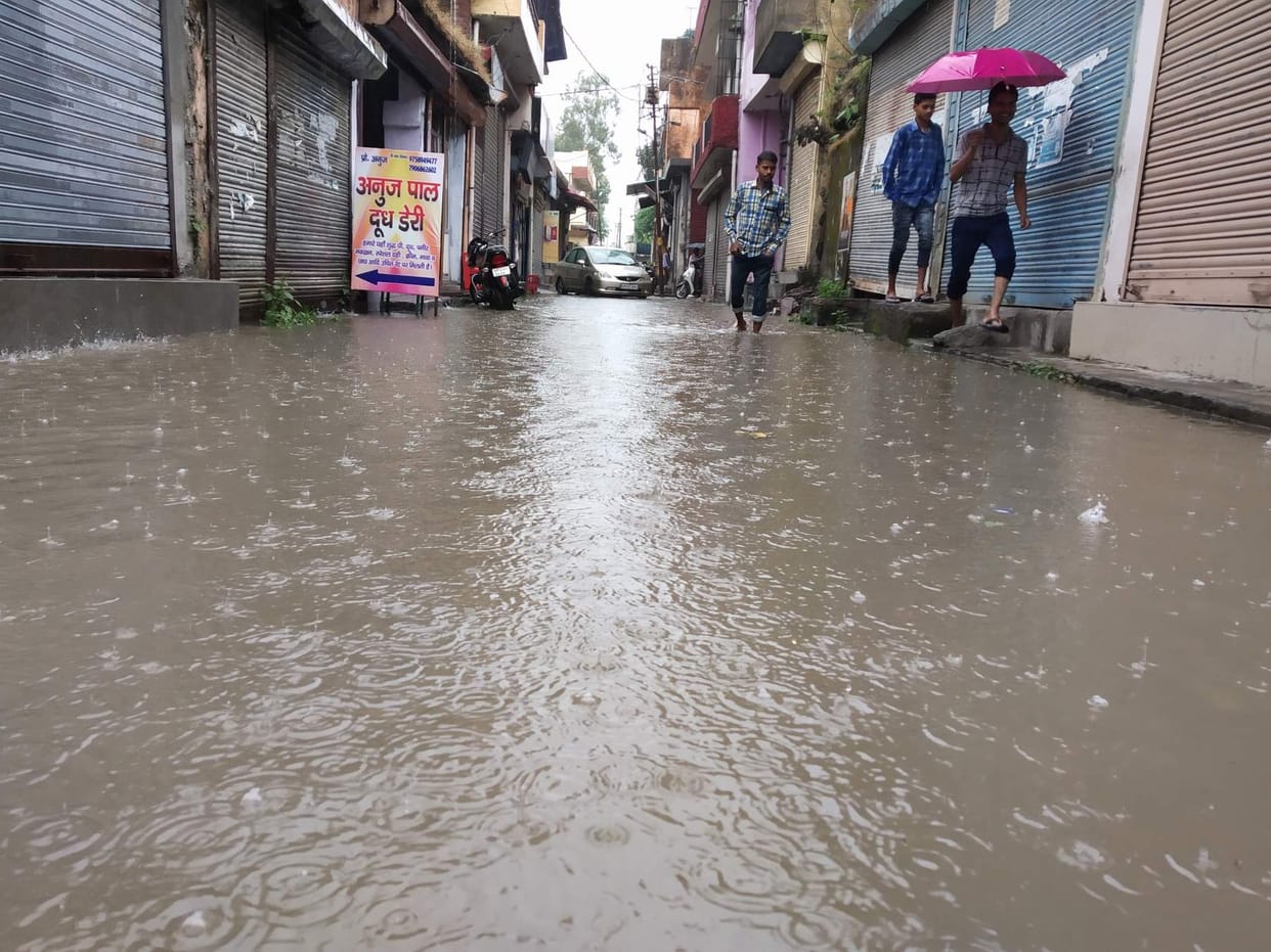 People enter the water due to rain