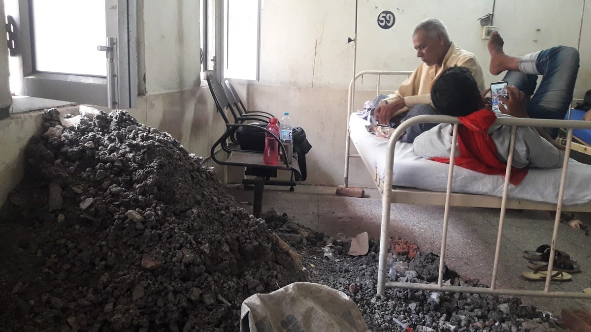 garbage debris dumped near patients beds in bhu hospital varanasi