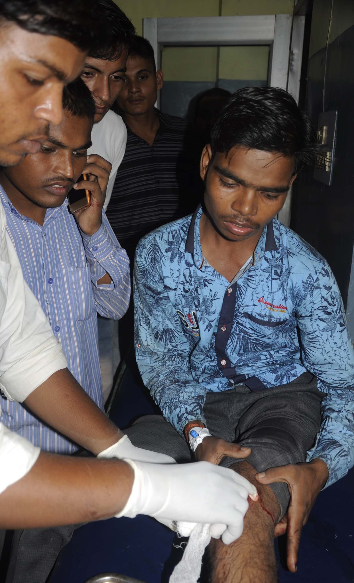 The crooks were firing, the bullet hit the student's leg