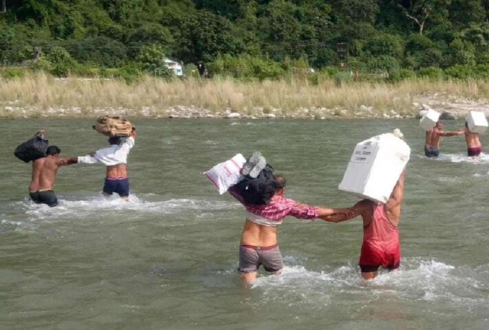 Uttarakhand panchayat election 2019 Polling Party members Hold luggage on head and Cross River