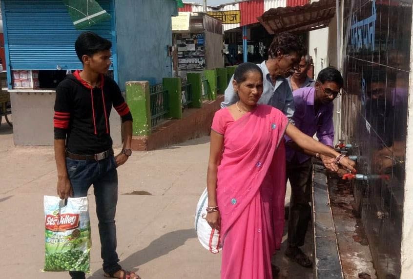 Passengers craving water drop by drop at railway station