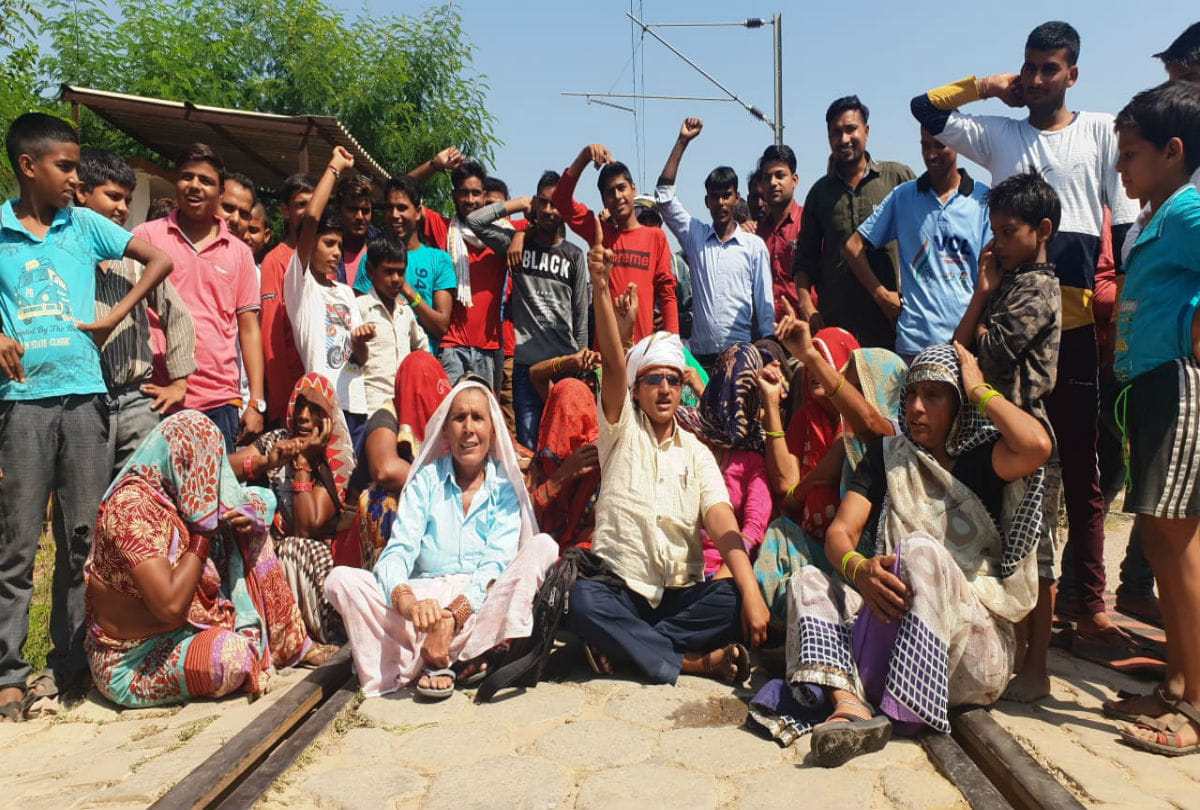 Villagers sit over railway track protesting against underpass in mathura
