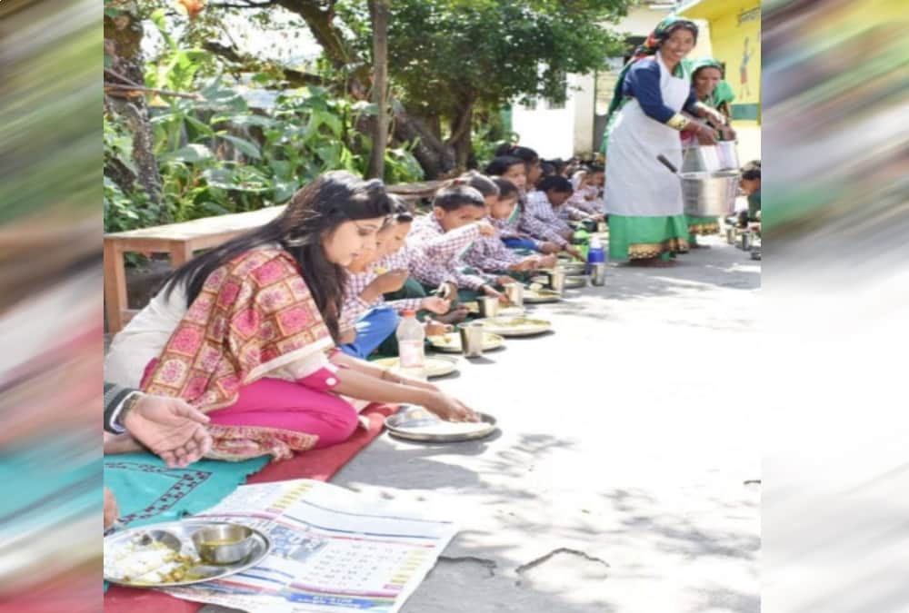 DM Chamoli Swati S Bhadauriya sit on floor and Ate mid day meal with Anganwadi students 