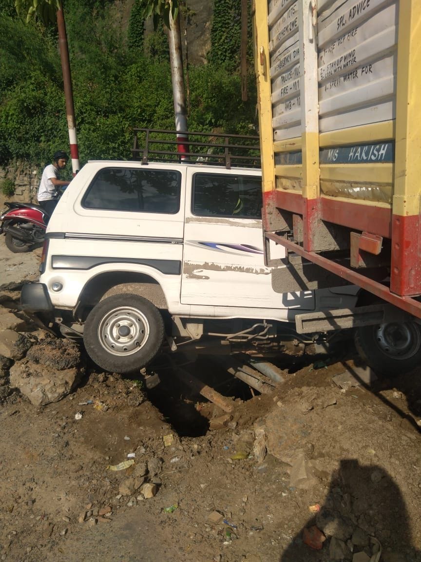 Cylinder-loaded truck hit school van