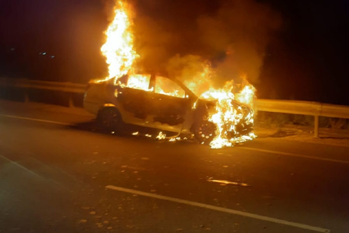 Fire's in a car from short circuit on road at Meerut of Uttar Pradesh