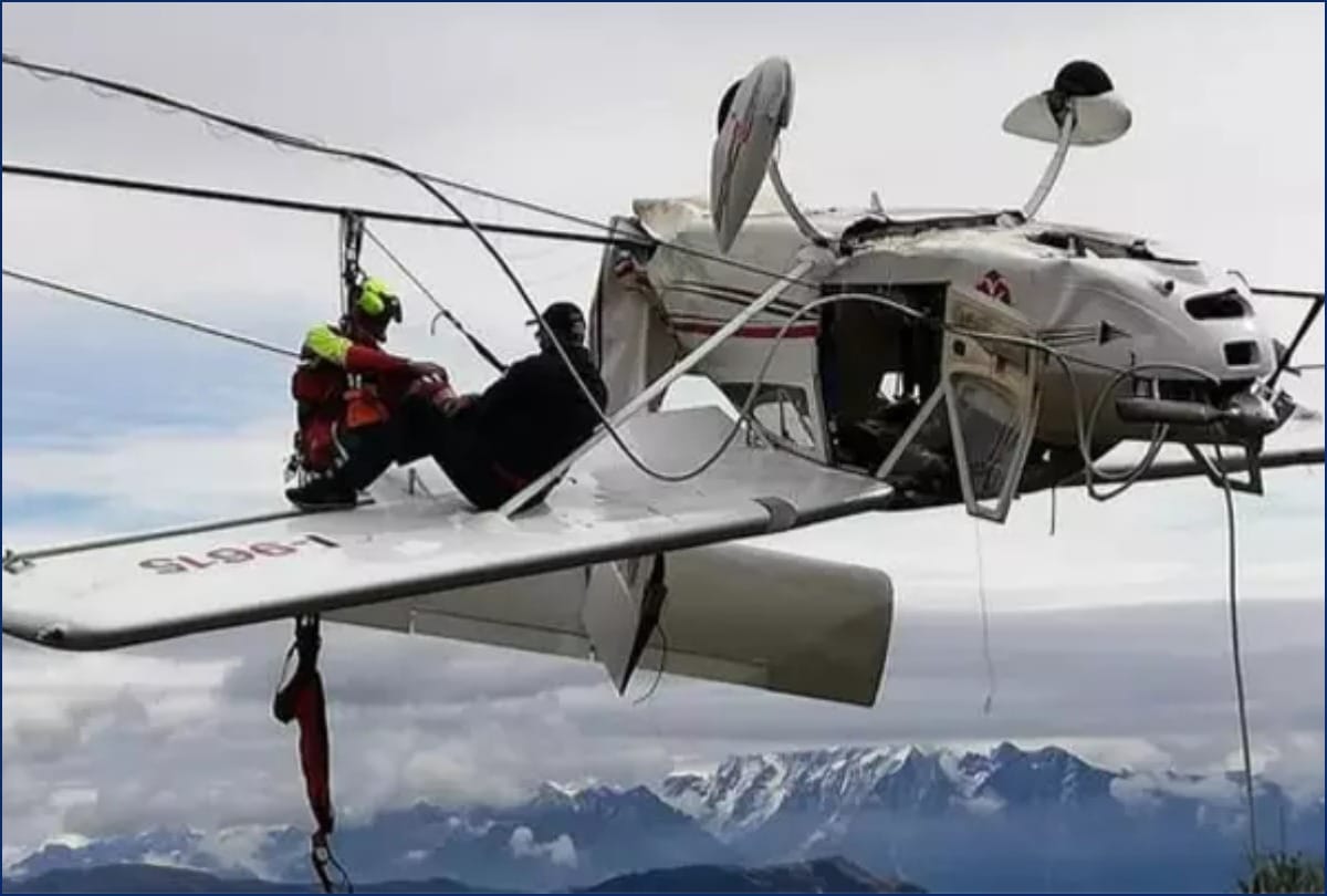 A Small Plane Dangles Upside Down From Ski Lift Cables After Crash In Italian alps