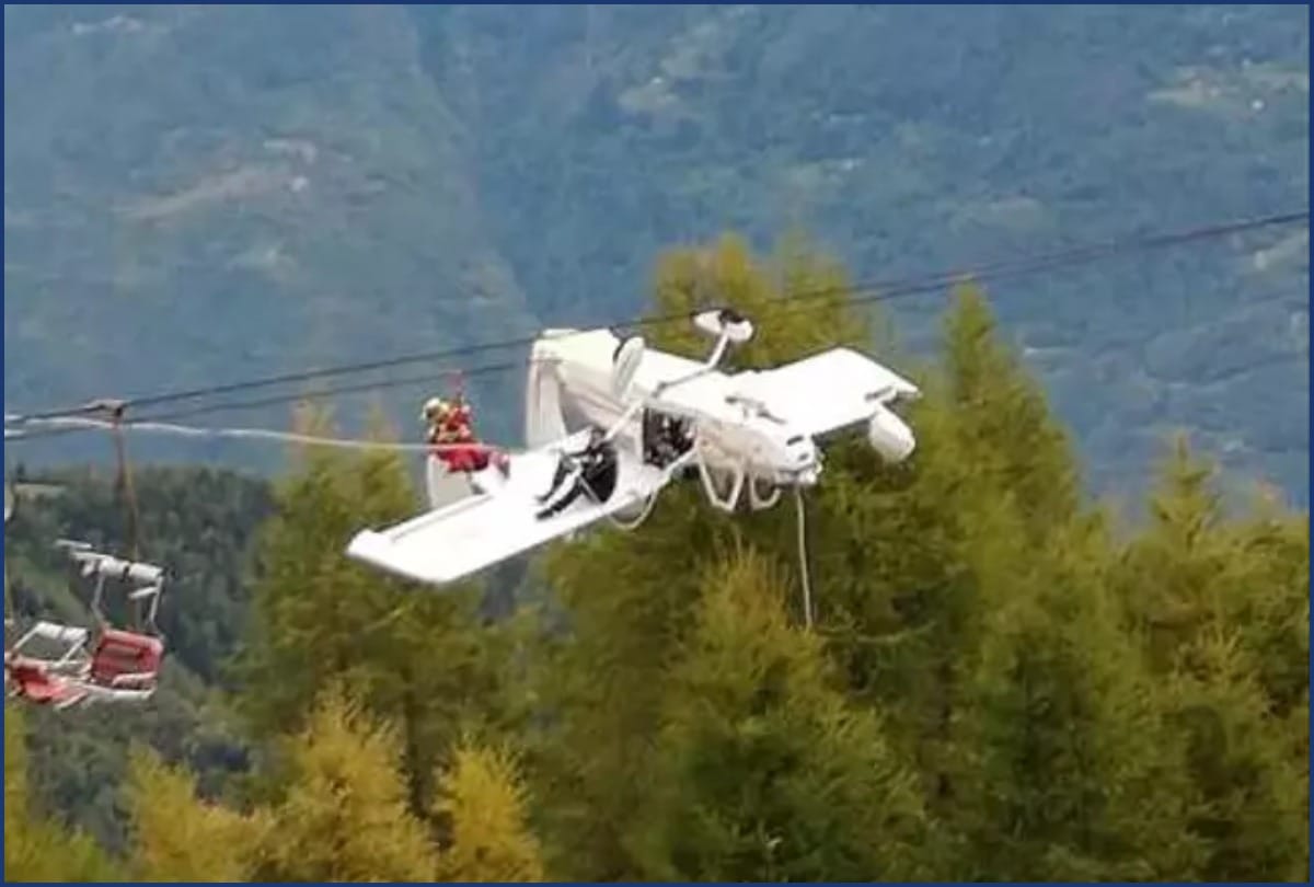 A Small Plane Dangles Upside Down From Ski Lift Cables After Crash In Italian alps