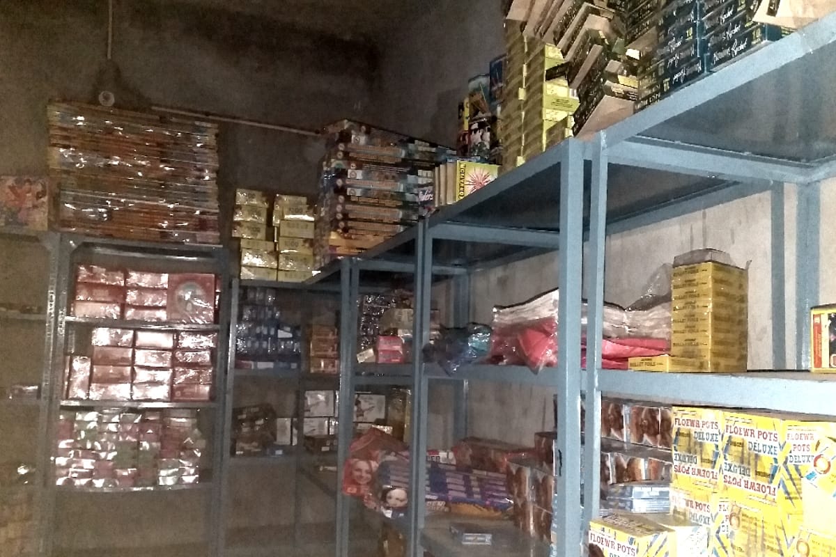 shopkeeper selling regular crackers in name of green crackers