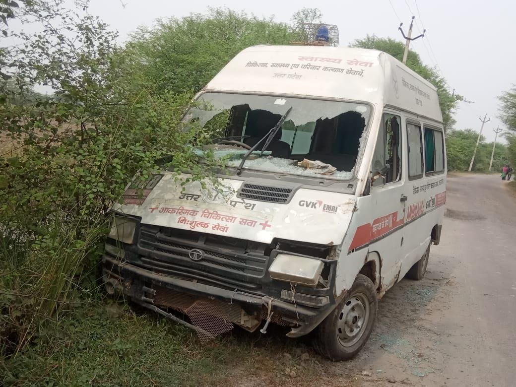 An ambulance standing in the woods, a vandalism occurred