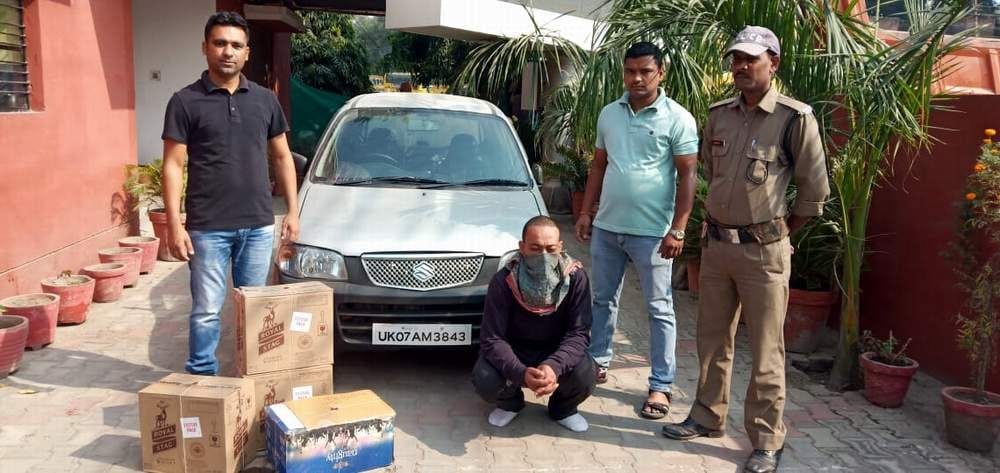 One arrested with four boxes of English liquor, carriage seized