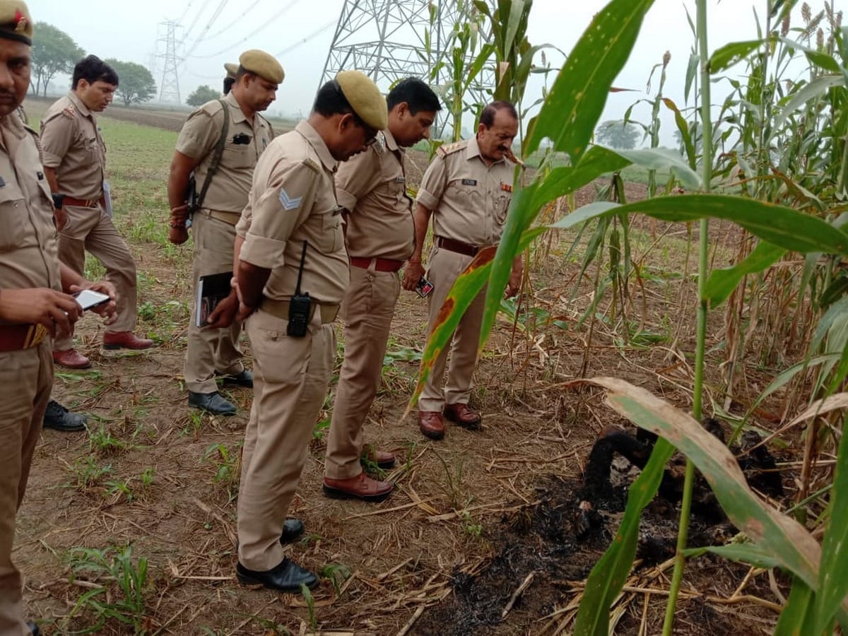 Half burnt dead body found in field police taking over stirred for post mortem varanasi