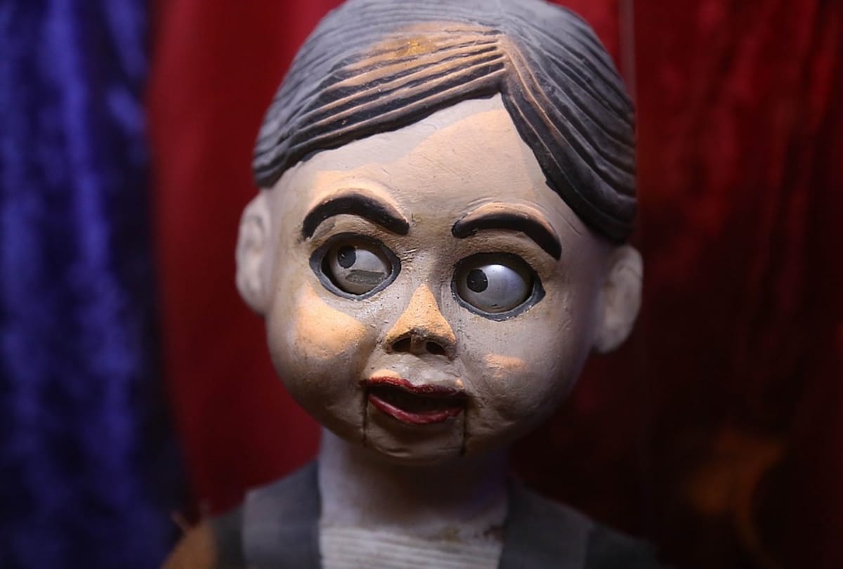 haunting moment ventriloquist doll blinks and moves its mouth