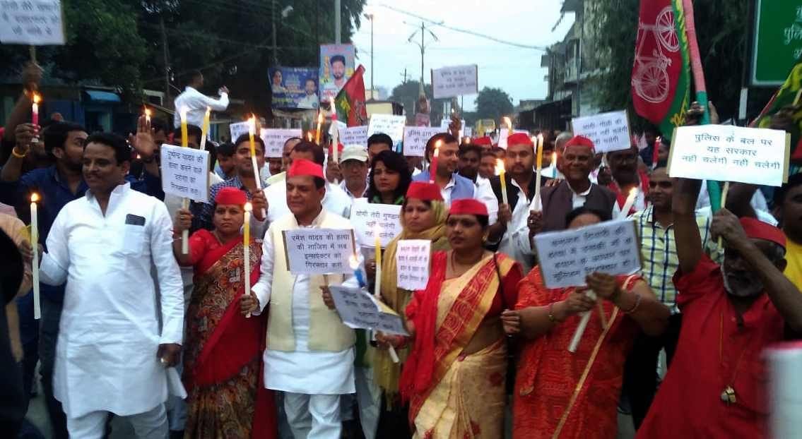 Candle march out, SP opens front against government