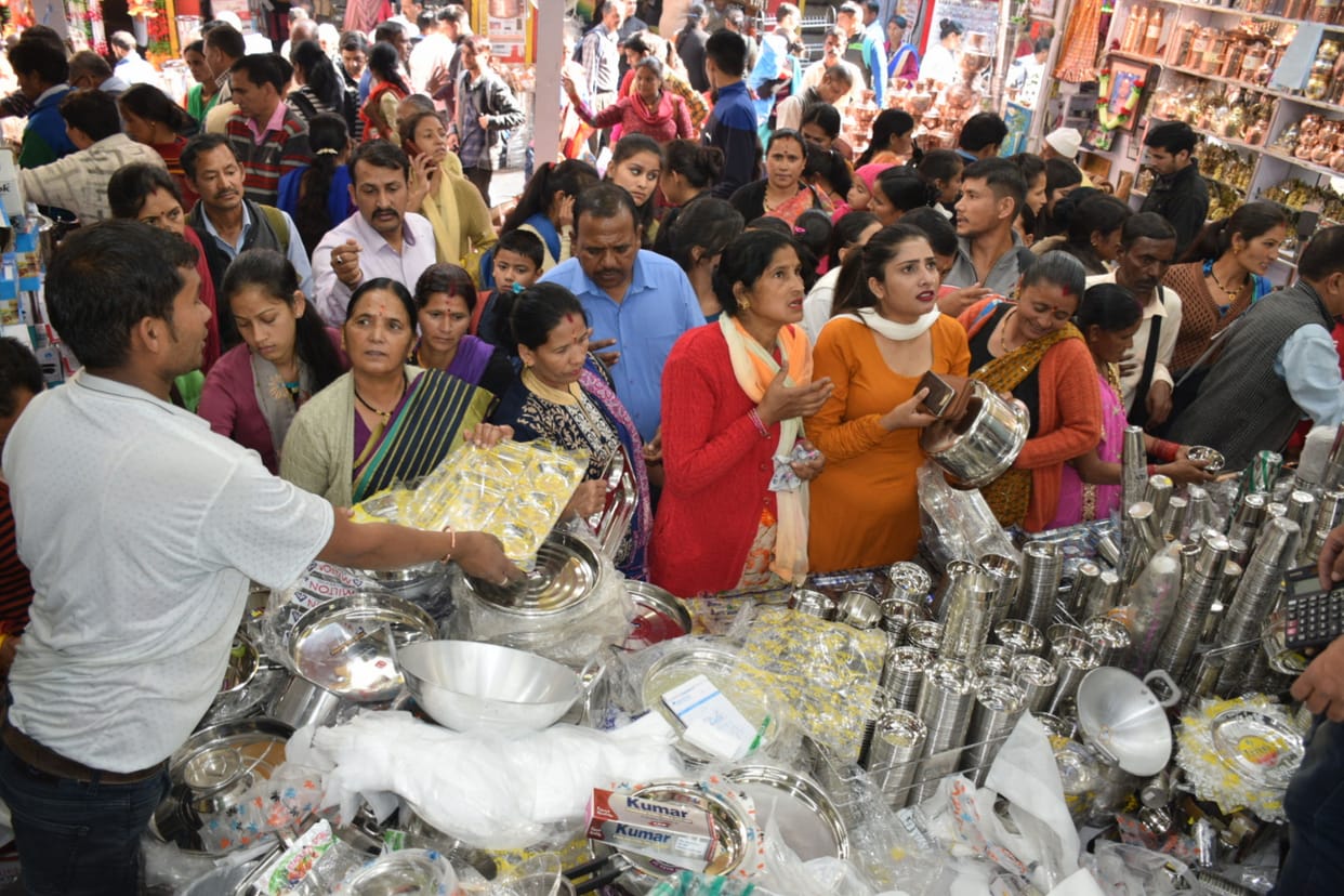 People shop fiercely all day on Dhanteras