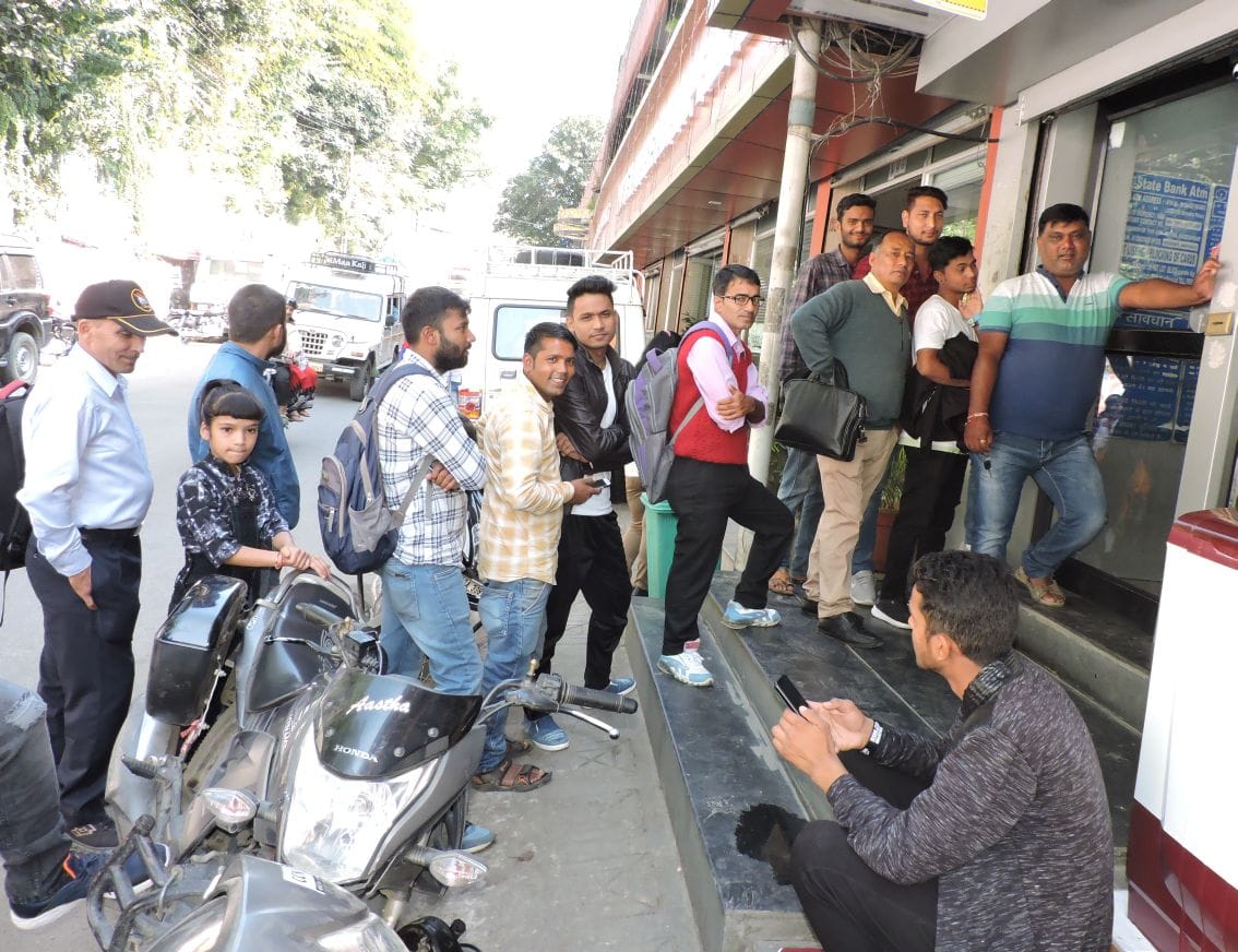 Crowd of people thronged ATMs for cash