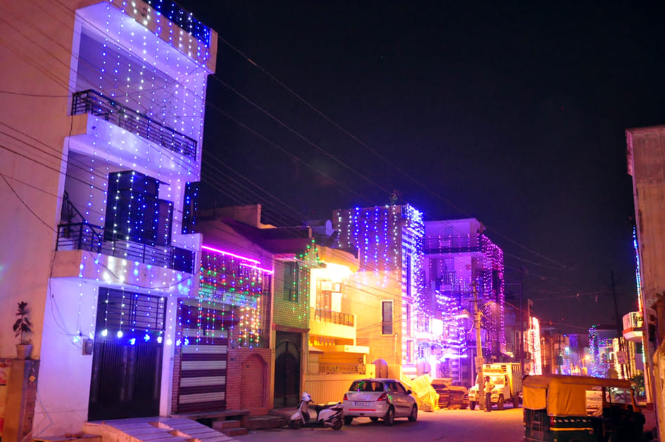 Colorful lights and cleanliness in VIP area, dirt in old city