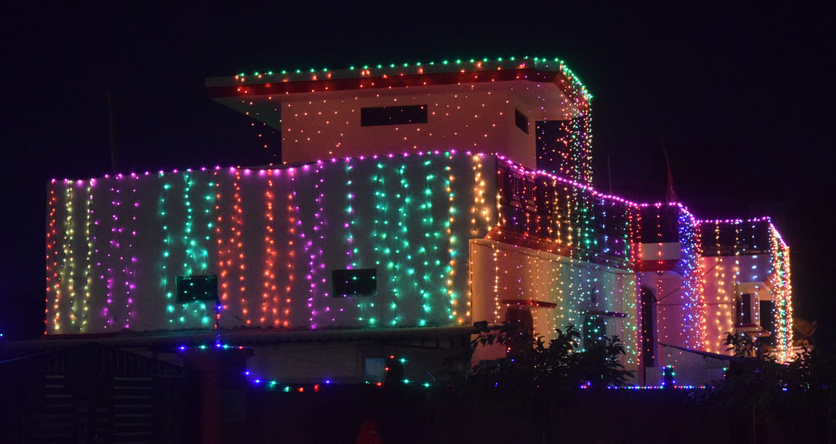 Home courtyard illuminated with lights