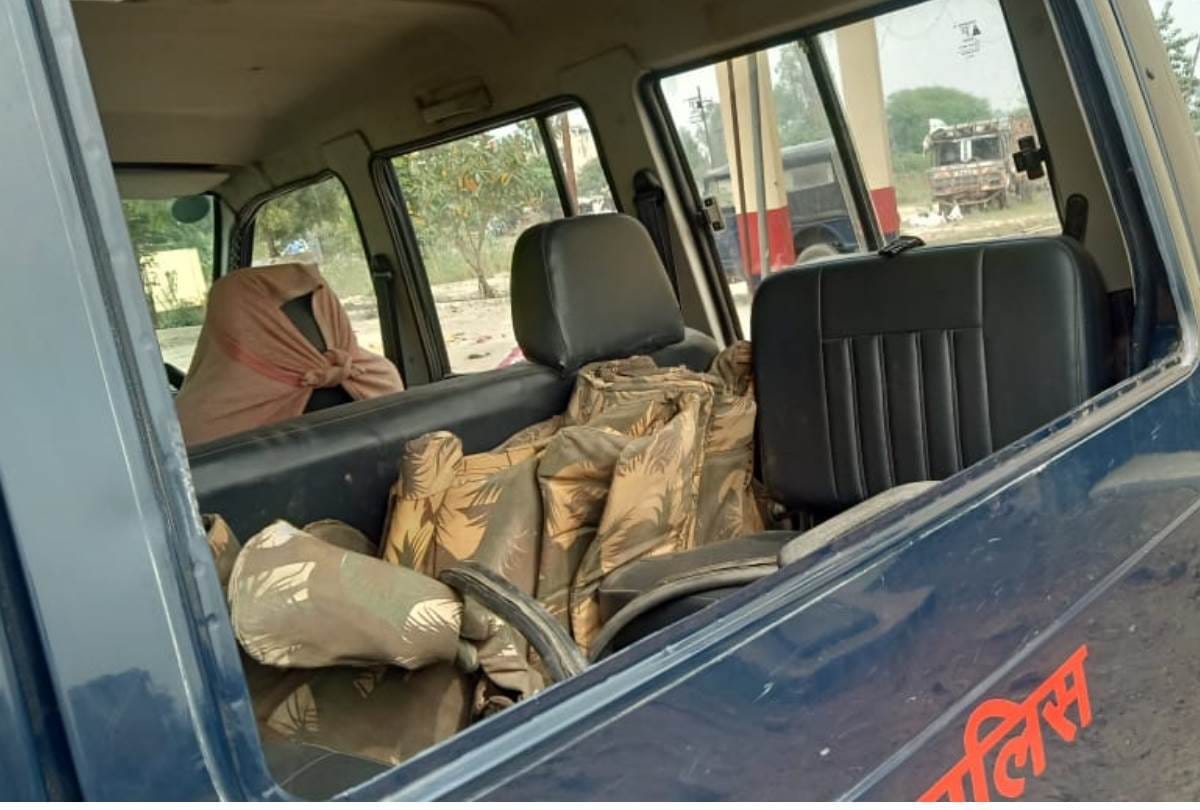 gamblers run as police raids the site then pelted stones and damaged the vehicle