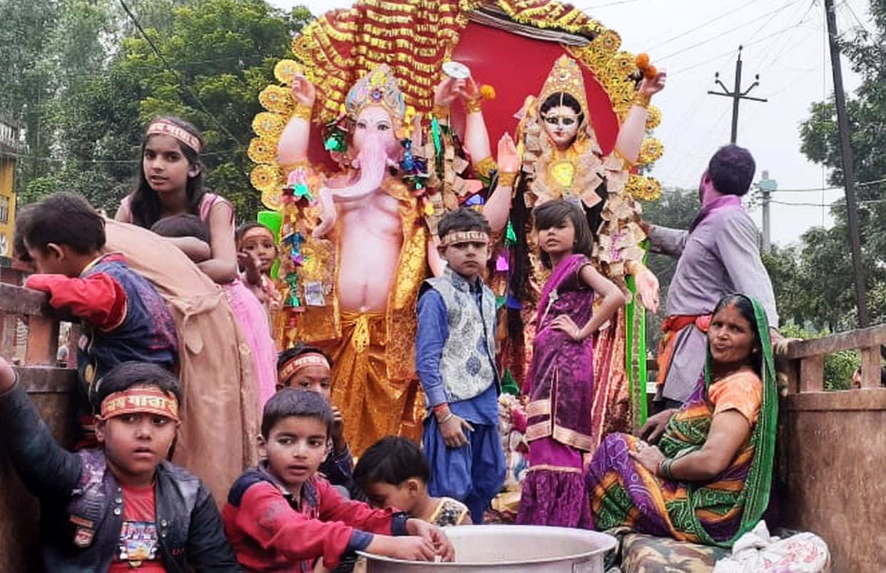 Ganesha-Lakshmi statue immersed with instruments