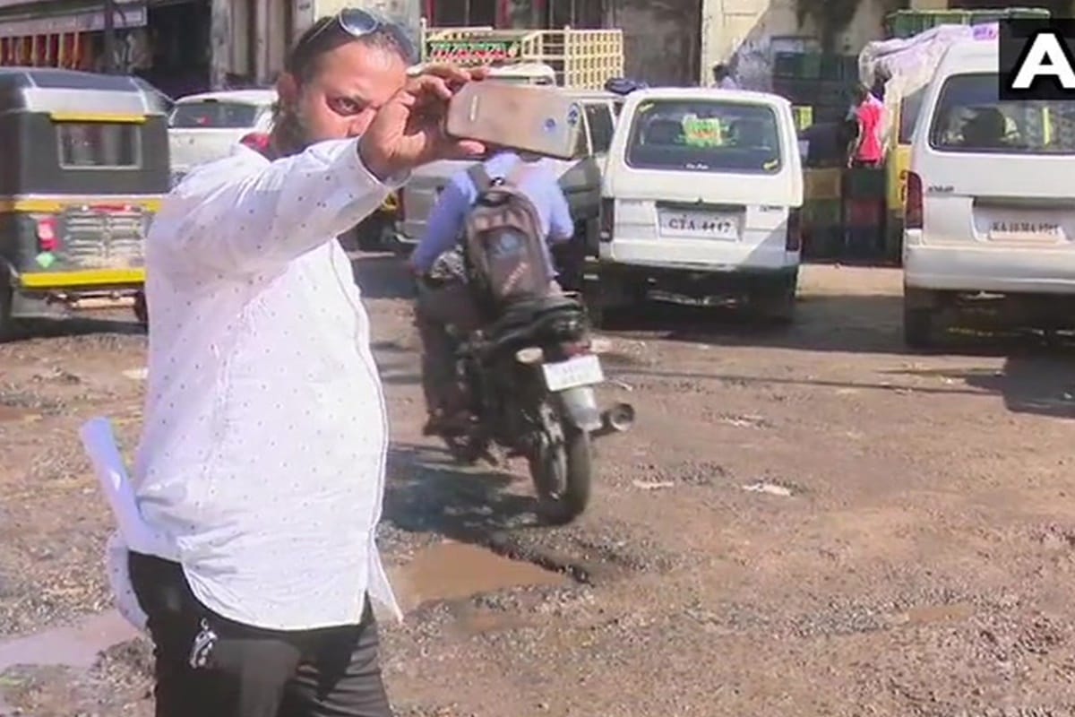 Karnataka MCC Civic Group launched campaign selfie with potholes in Mangaluru