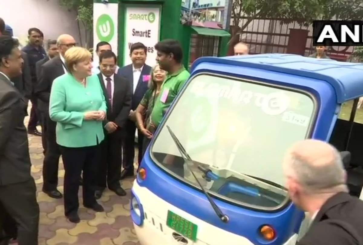 Germany chancellor angela merkel meets e rikshaw operators dwarka delhi invest 1 bn euro in india