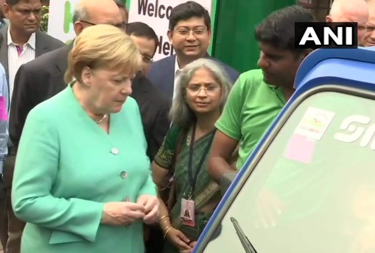 Germany chancellor angela merkel meets e rikshaw operators dwarka delhi invest 1 bn euro in india