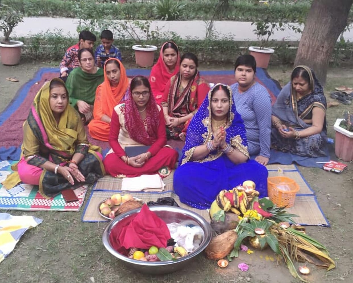 Offering water to Chhatha Mata by offering arghya to the rising sun