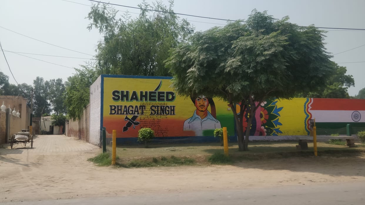 the youth got the painting on the dirty walls of the village with their own money