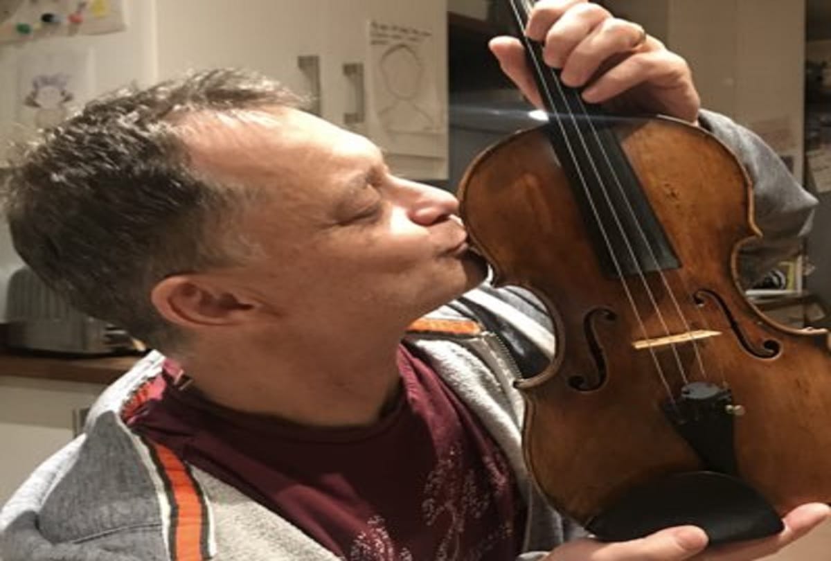 310 year old antique violin stolen from a train has been reunited with its owner